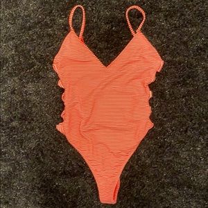 Red and white bodysuit with side slits